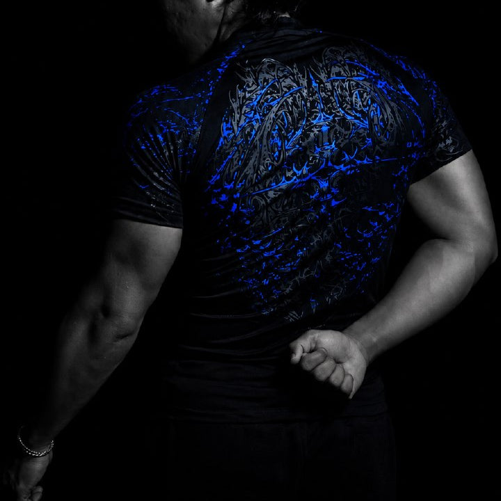 Peakathlete Philippine Model wearing a black oversized gym T-shirt with a blue gothic Obsidian Void graphic compression shirt.
